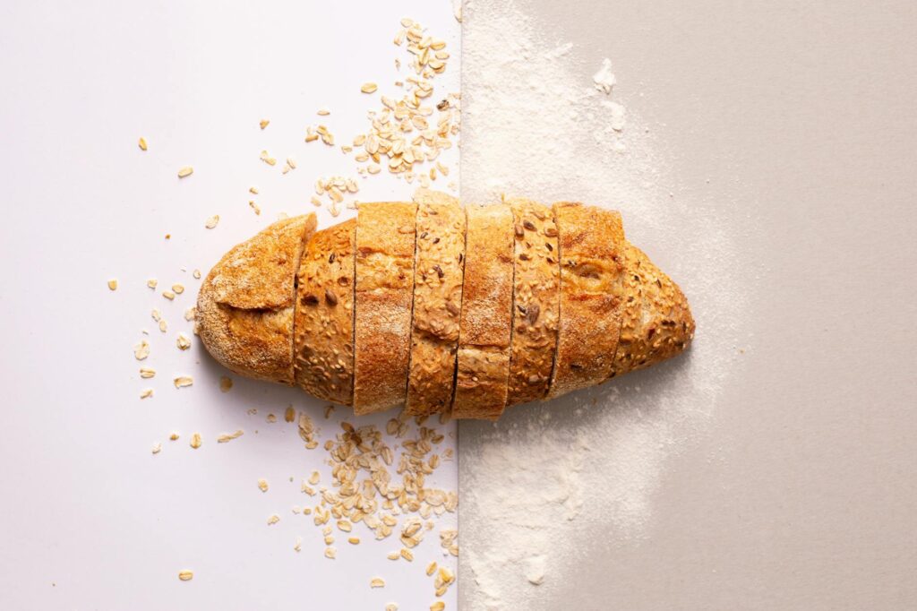 Freshly sliced whole grain bread with oats and flour provides a rustic and nutritious appeal. - Easy Homemade Oat Flour Recipe in 5 Minutes
