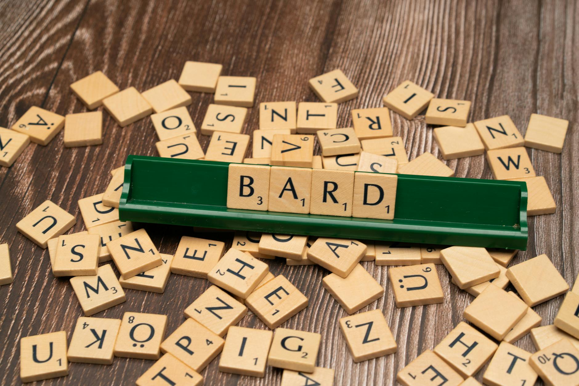 Google DeepMind's AI Email Assistant to Reply in Your Style 1 Scattered wooden tiles displaying letters with the word BARD on a green rack. - Google DeepMind's AI Email Assistant to Reply in Your Style