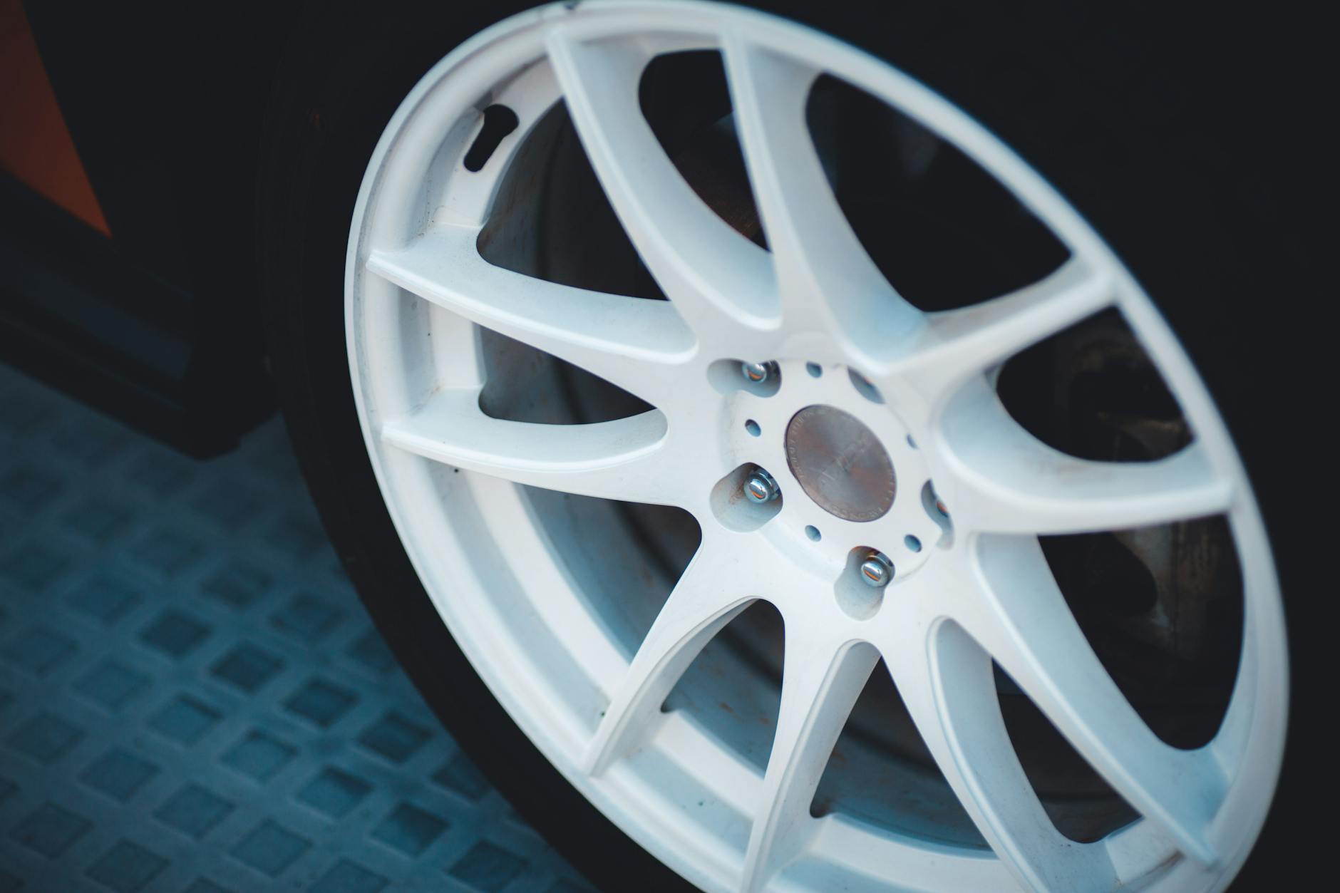 Vijay Mallya Claims Banks Recovered ₹14,000 Cr Against ₹6,203 Cr Loan 1 Detailed close-up of a white alloy car wheel showcasing design and craftsmanship. - Vijay Mallya Claims Banks Recovered ₹14,000 Cr Against ₹6,203 Cr Loan